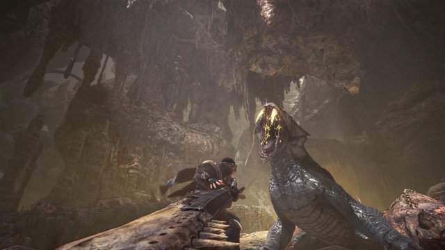 Player fighting a boss in a cave in Monster Hunter World.