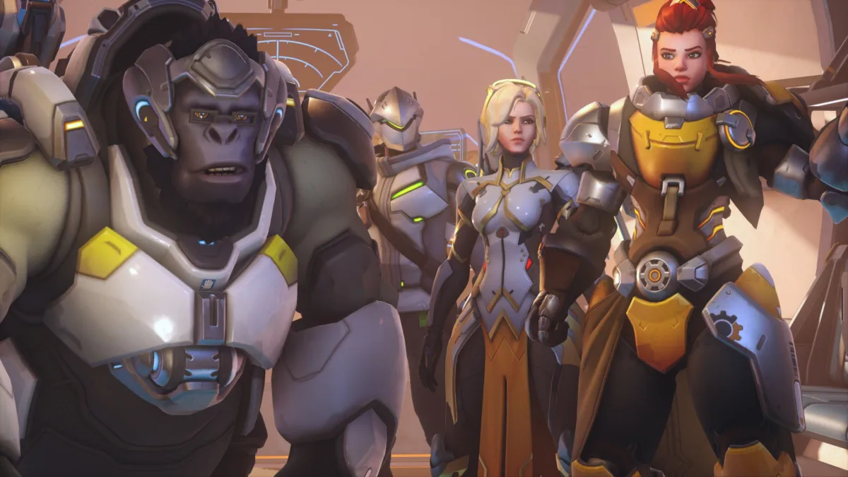 Overwatch heroes standing together, including Winston, Mercy, and more.