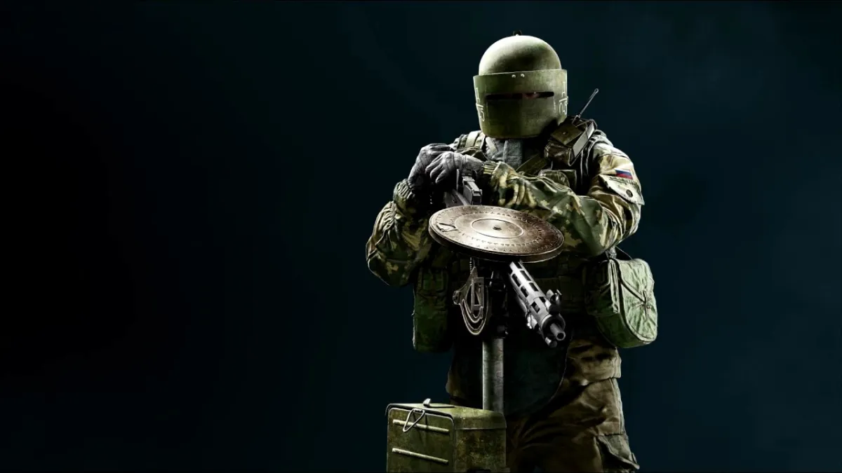 Tachanka rests his hands on a turret.