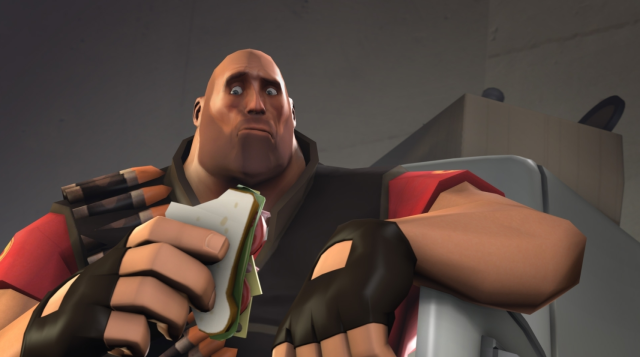 Image of the Heavy, eating a Sandwich from the team refrigerator. 