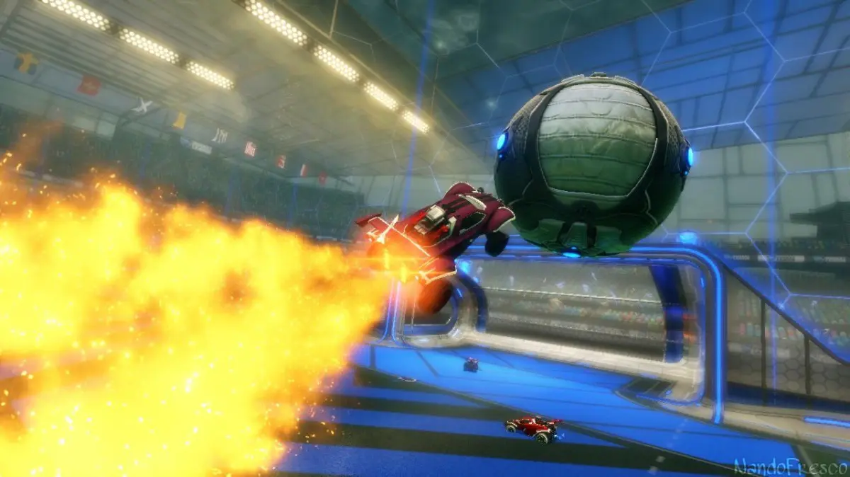 A car in rocket league boosting through the air toward the ball.