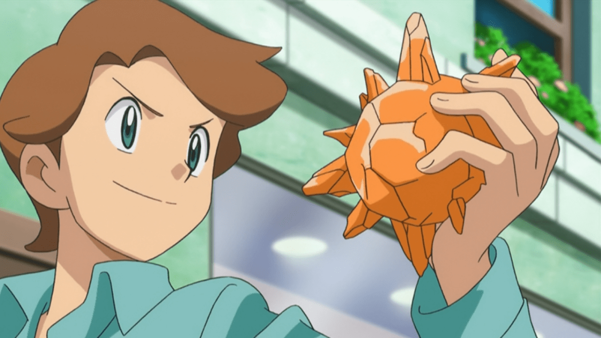 Pokémon trainer proudly holding a Sun Stone in the anime.