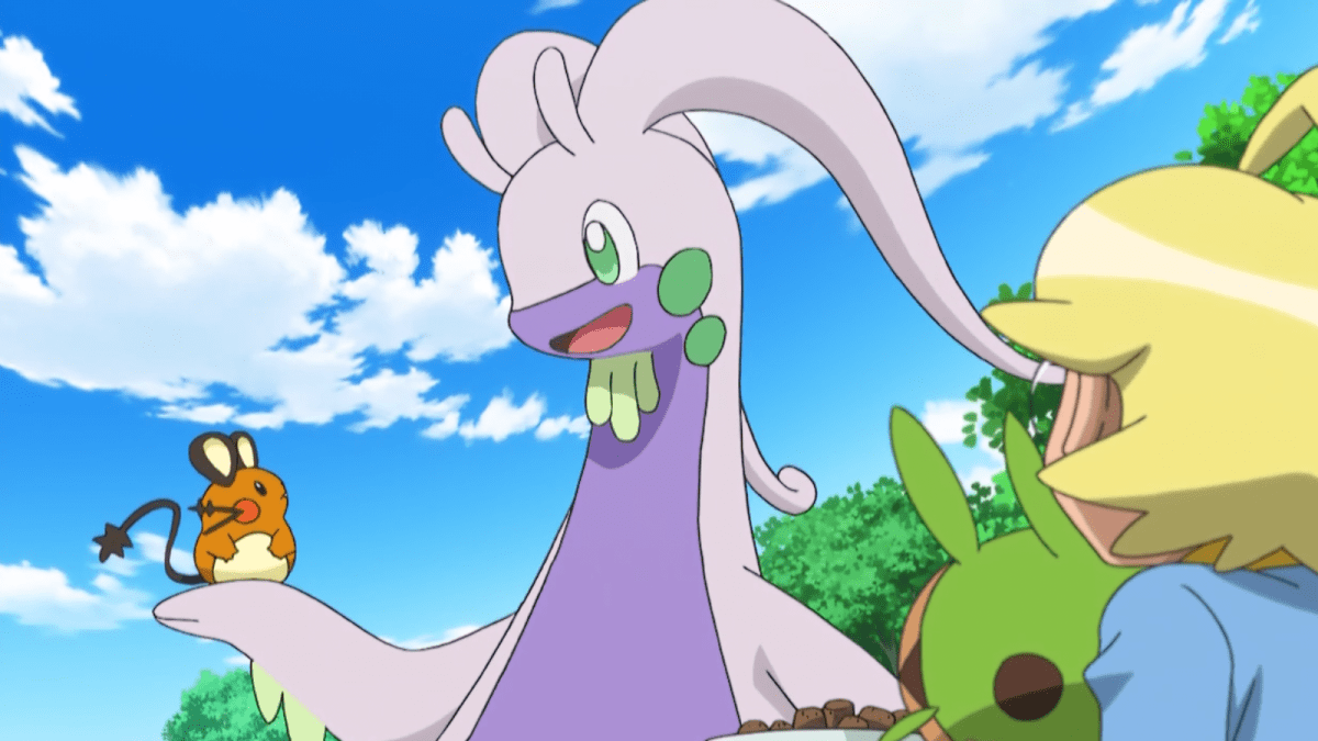 A happy Goodra holding a Dedenne in the Pokémon anime.