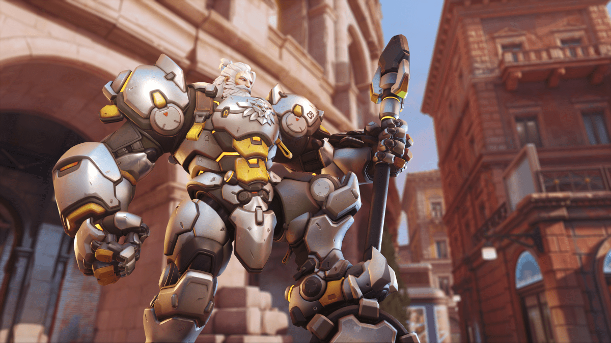 Reinhardt poses with his hammer planted on the ground in front of Colosseo.