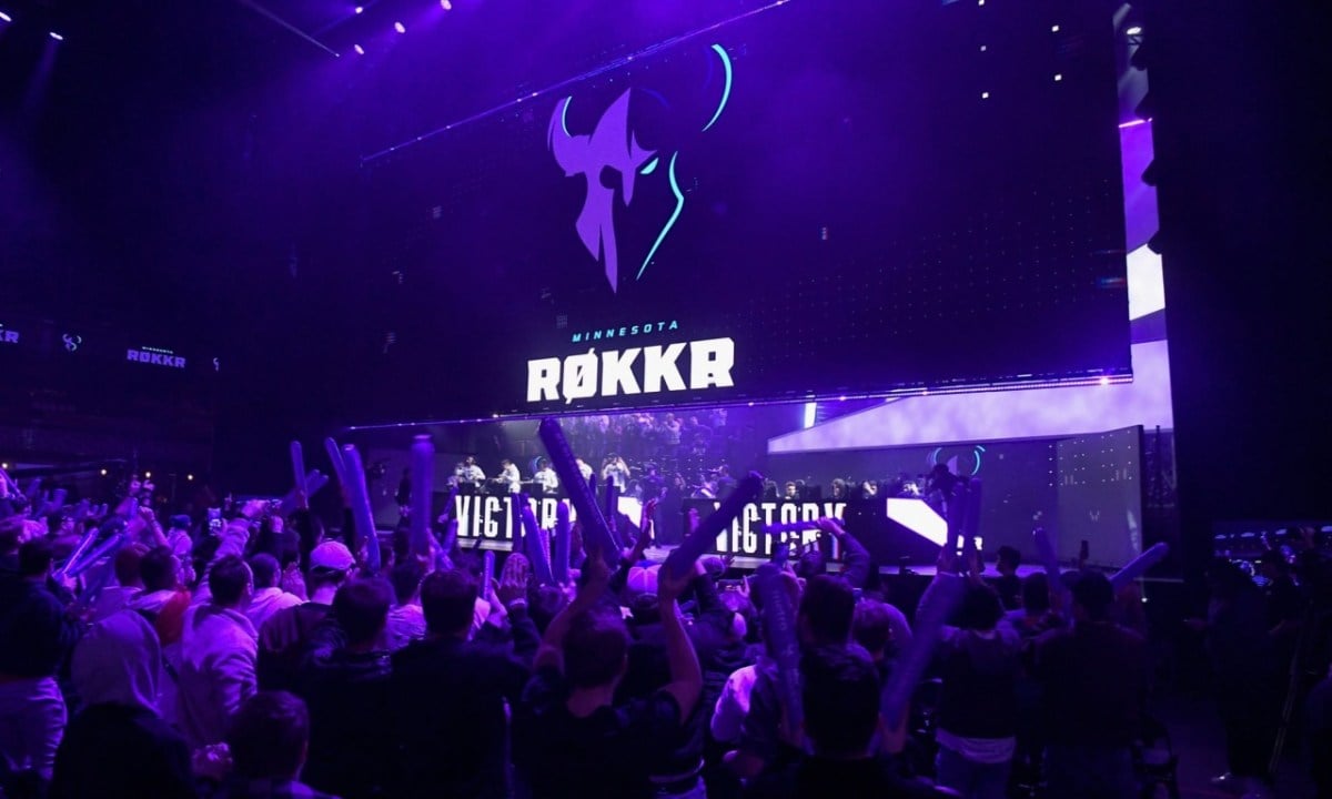 Minnesota Rokkr logo hovering over the team on-stage.