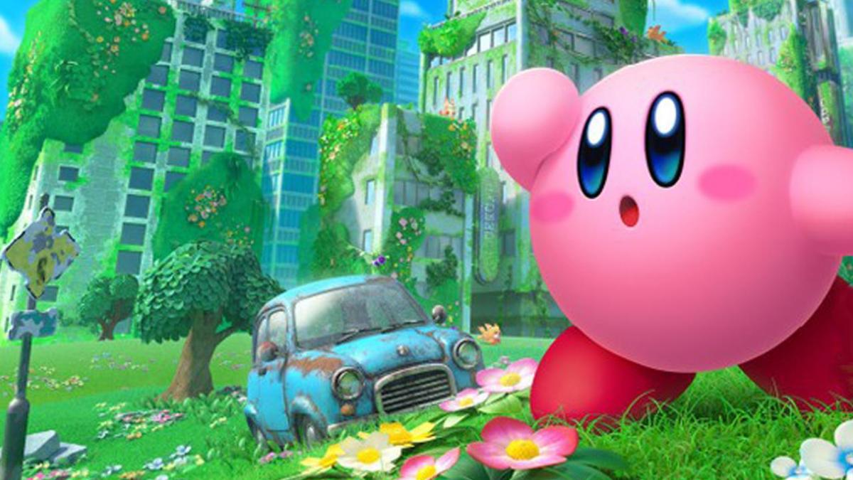 Kirby looks into the distance while standing in a run down and overgrown city in Kirby, The Forgotten Land.