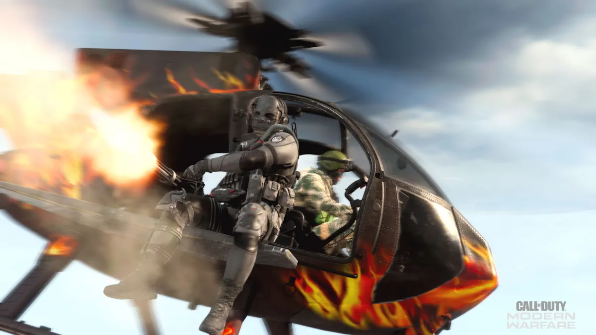 An image of a Call of Duty operator firing a minigun from a chopper.