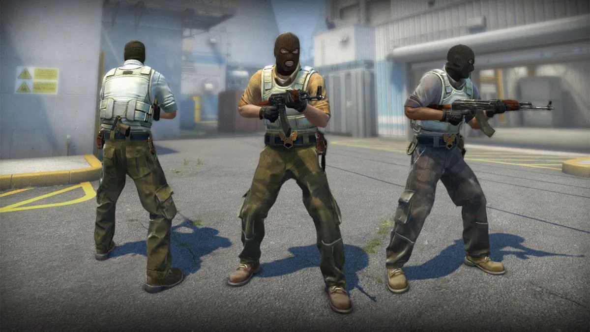 Three CS:GO characters holding weapons.