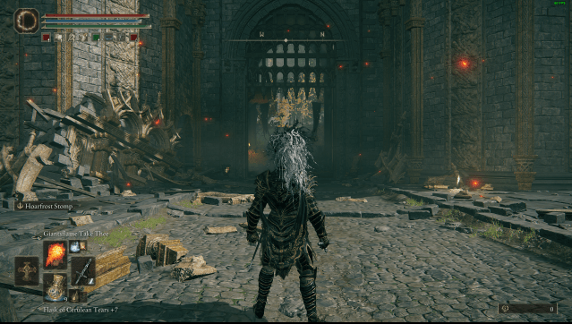 A screenshot of a character standing outside Stormveil Castle in Elden Ring