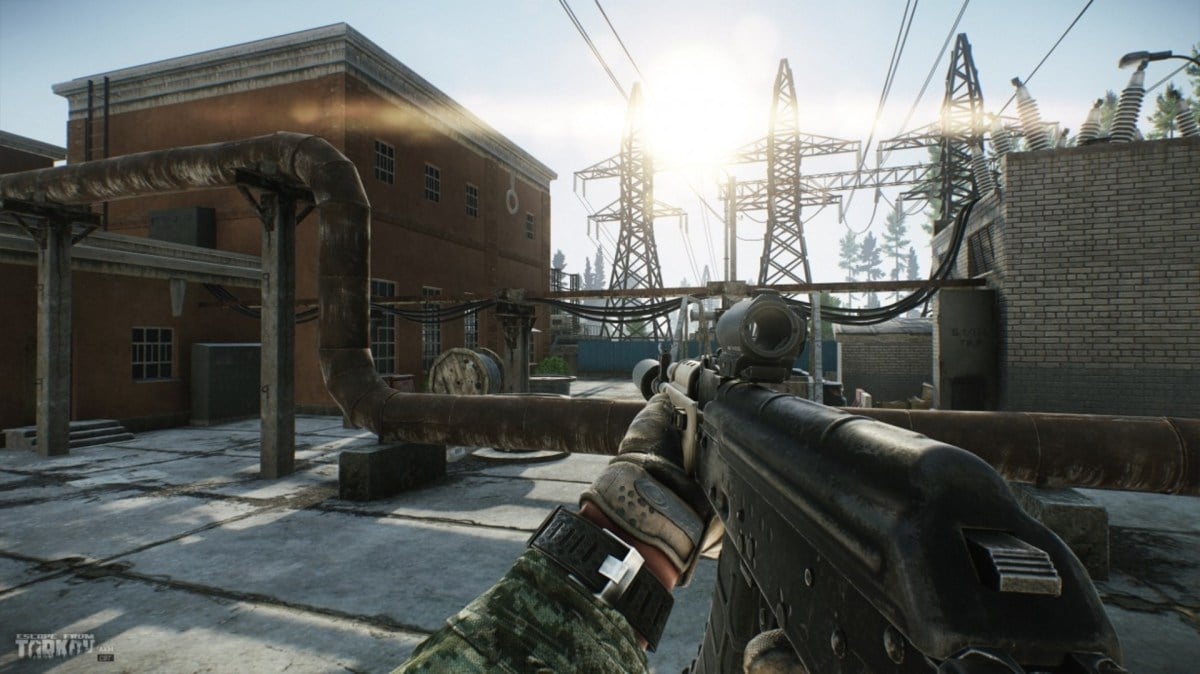 The sun shining through some powerlines in a screenshot from Escape From Tarkov.