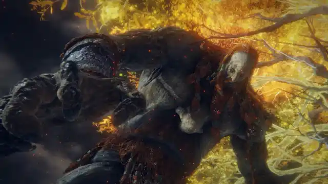 Fire Giant in Elden Ring, boss image of the giant featuring his iconic red hair and beard, as well as his massive frame.