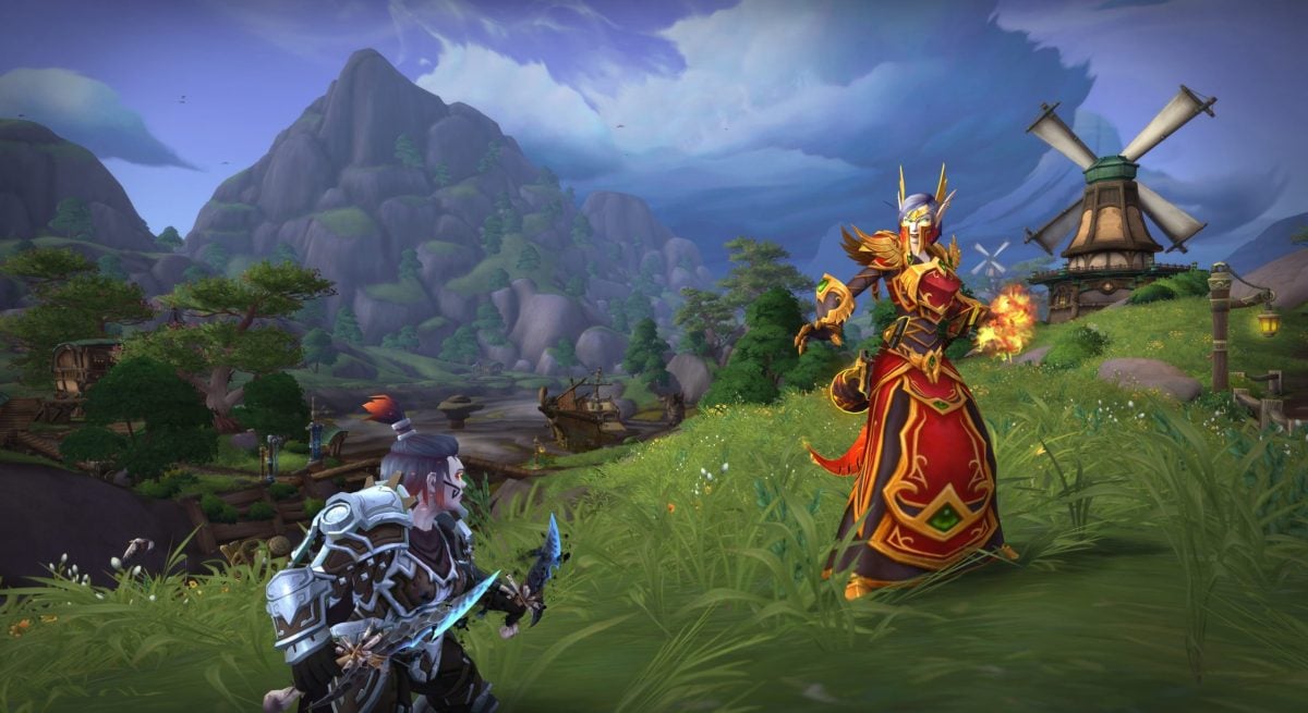 A dwarf and a blood elf square off in combat in Stormsong Valley, World of Warcraft.