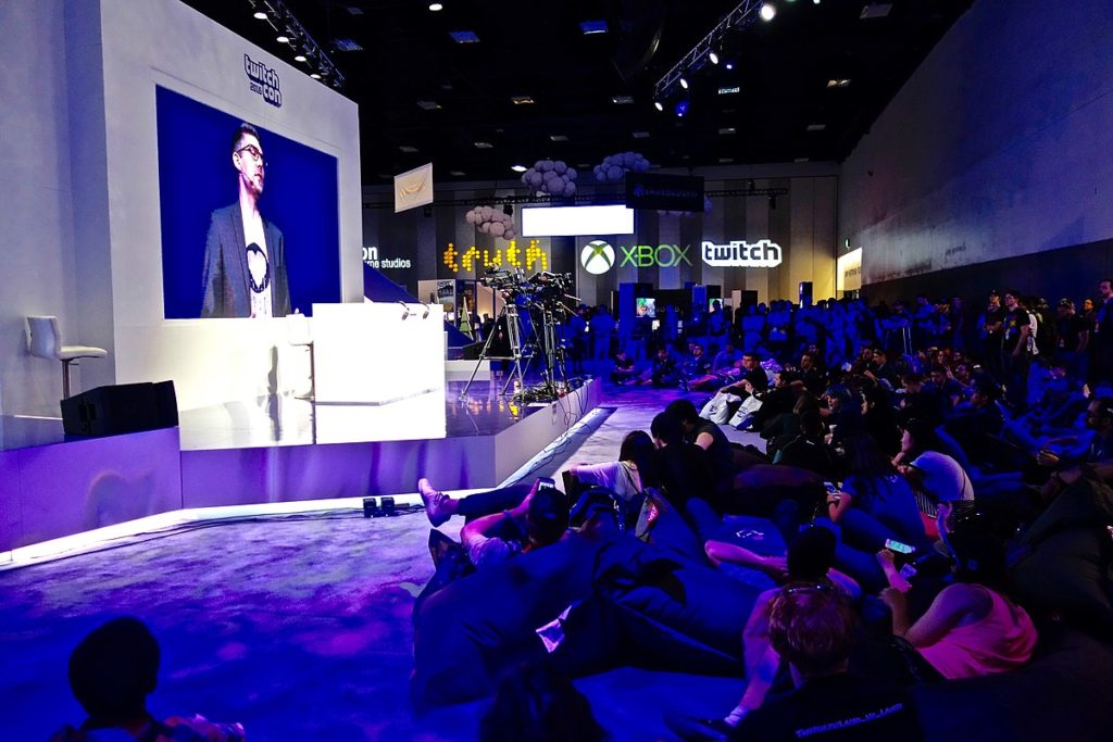 A crowd of TwitchCon attendees watching a cosplay contest in 2016.