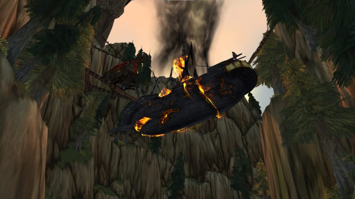 A looking-upward view of the burning boat on the way into the Howling Fjord in WoW: Wrath of the Lich King.