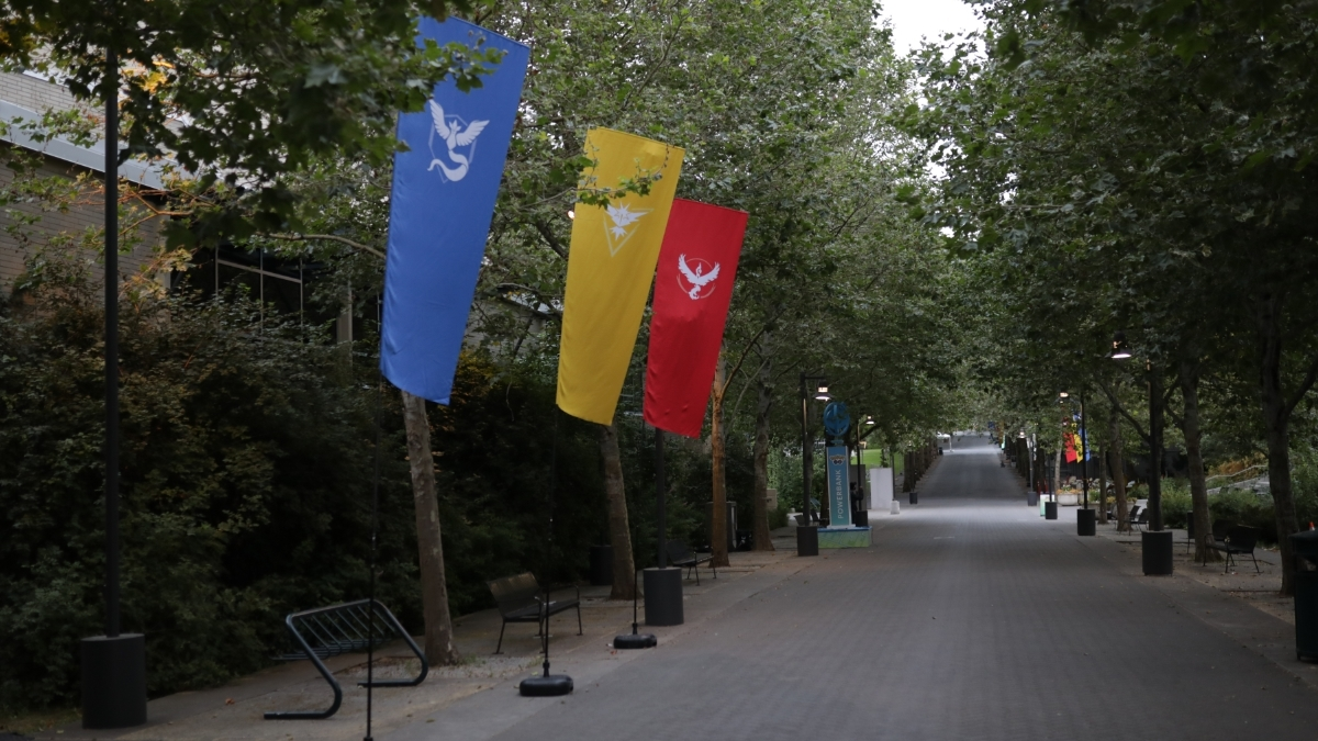 A path lined by Pokemon Go team banners.