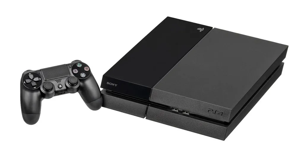 A PS4 and matching controller laid flat.