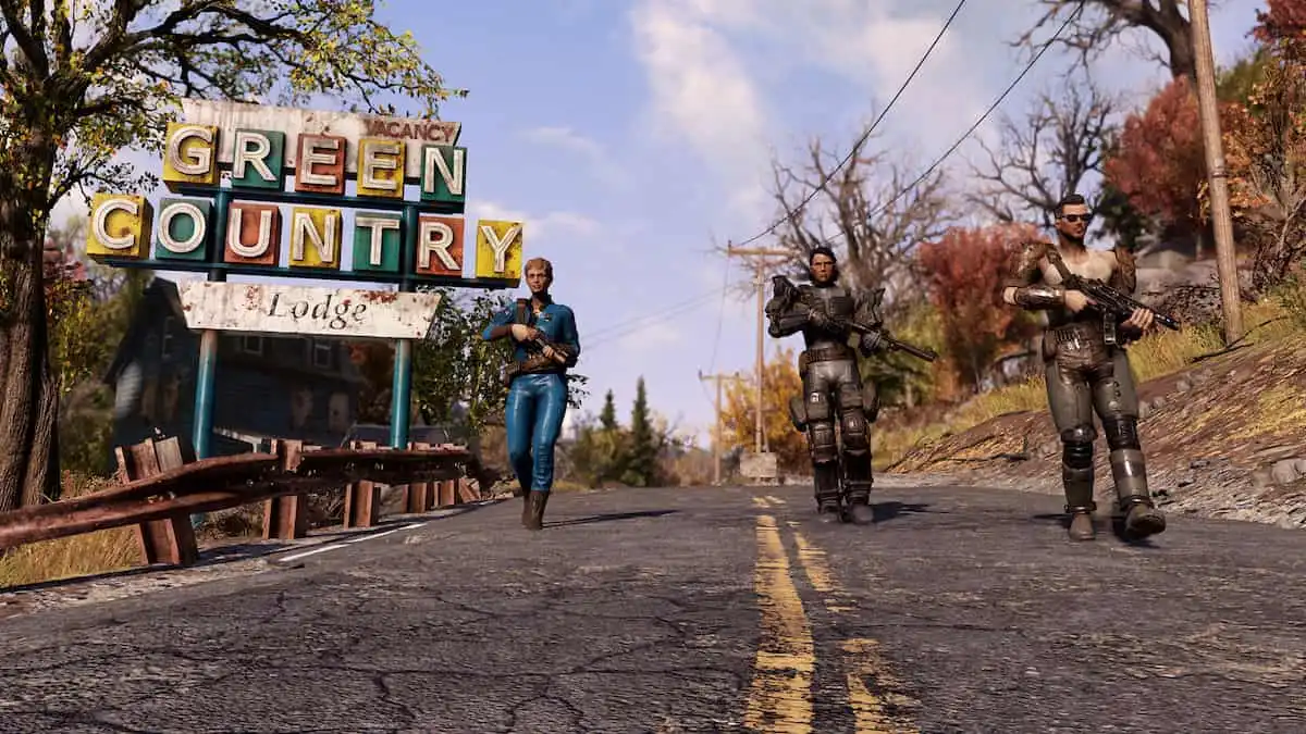 Three Fallout 76 players are walking on a road