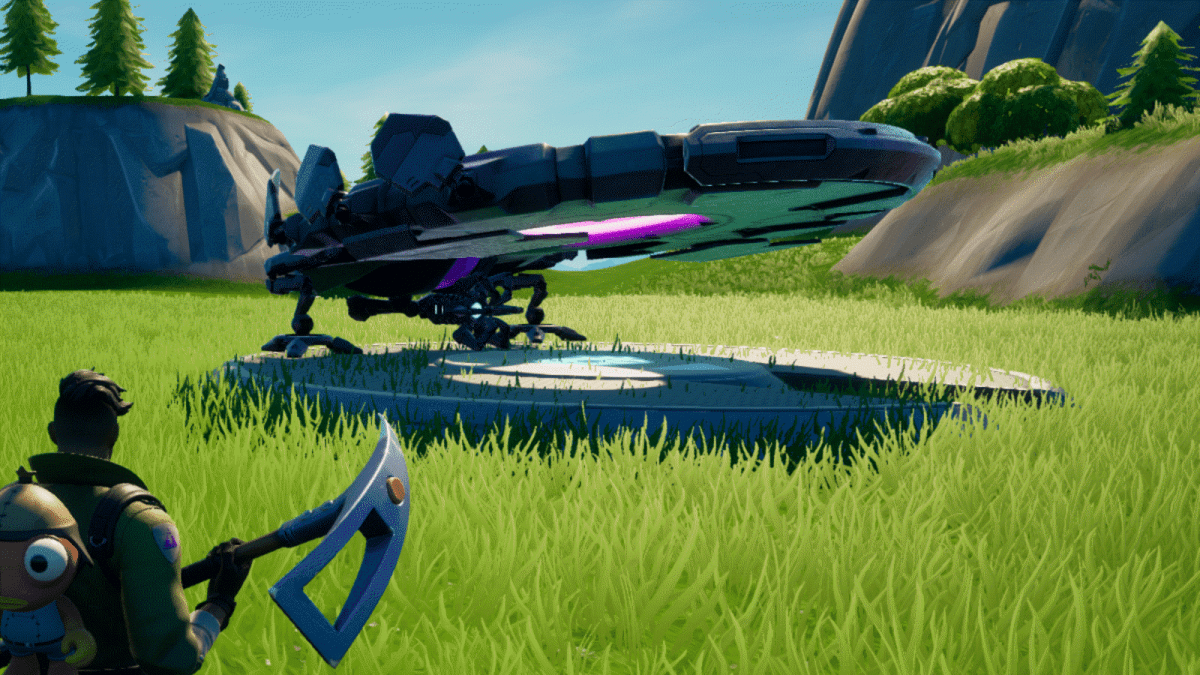 A character in Fortnite looks at a UFO