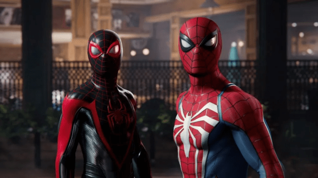 Miles Morales and Peter Parker in Spider-Man suits looking towards the camera