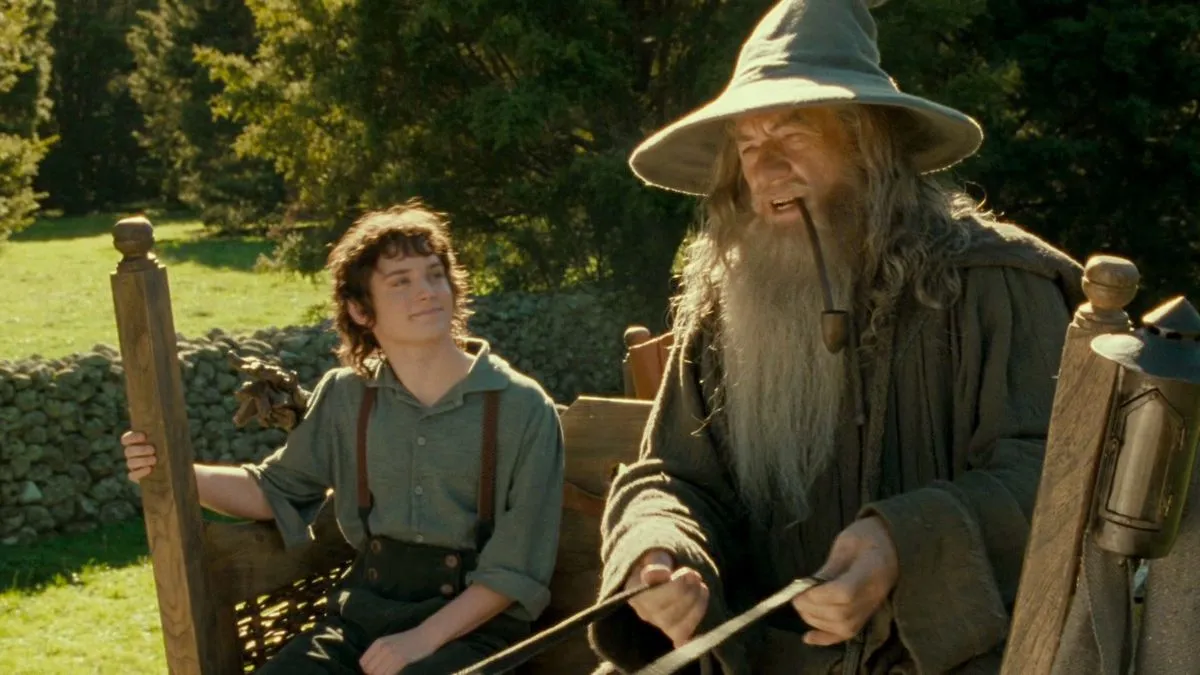 An image from the first Lord of the Rings movie, with Frodo and Gandalf riding on a wagon