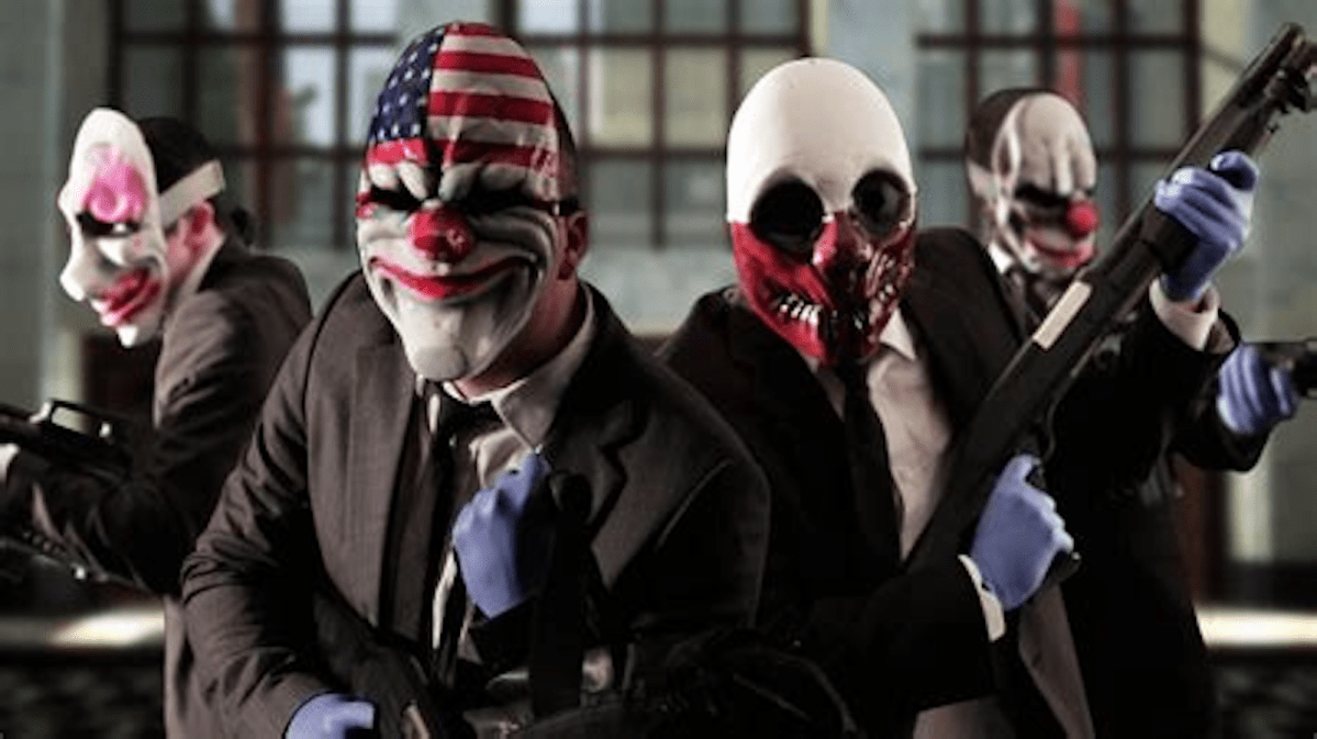 The heist team from Payday 3, dressed in clown masks and heavily armed, stare forward.