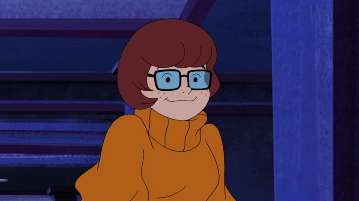 A screengrab from Scooby Doo showing Velma Dinkley smiling