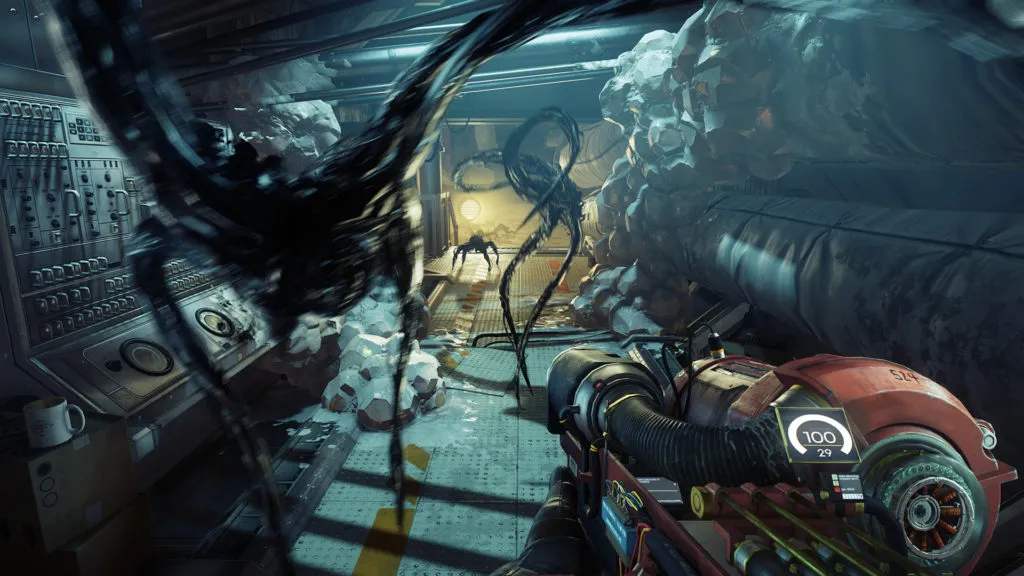 A screengrab from Prey showing three spider like monsters lash out extended arms toward the player