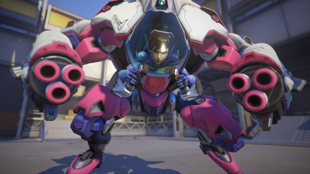 An image of D.Va inside her mech looking at the camera with her Fusion Cannons ready to shoot.