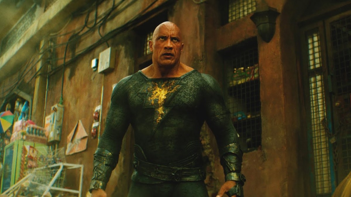 A screengrab from the Black Adam trailer showing the character in his trademark black suit with a lightning bolt