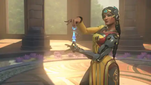 Symmetra holding a irregular contraption bathed by the daylight hours in an arcane set in Overwatch 2.