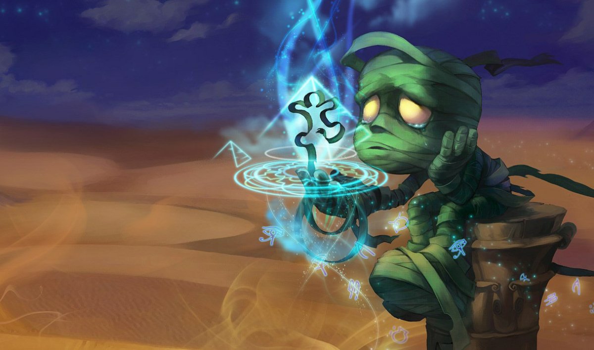 Amumu, a small green mummy-like creature wrapped in green ropes, sitting sadly on a post while magically manipulating a strand in League of Legends.
