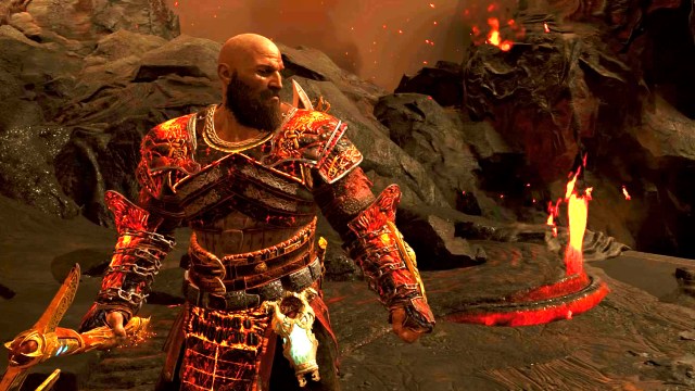 Kratos stands in Muspelheim before a rock that's flowing lava in God of War Ragnarok
