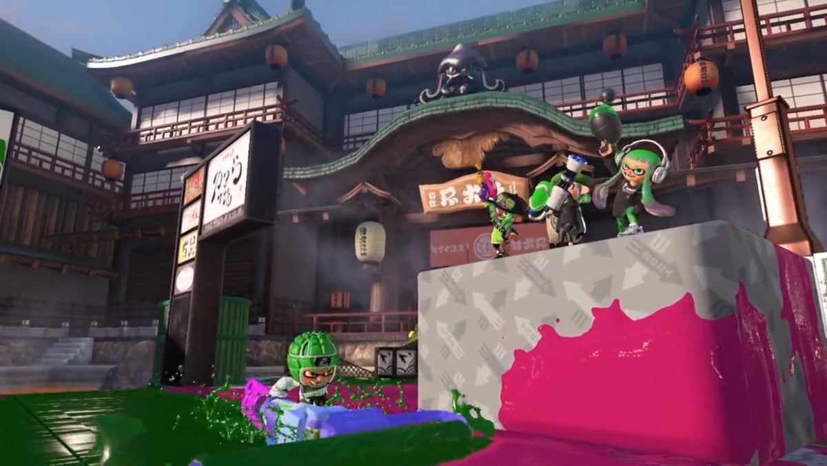 Three Inklings cheer on their teammate during a battle.