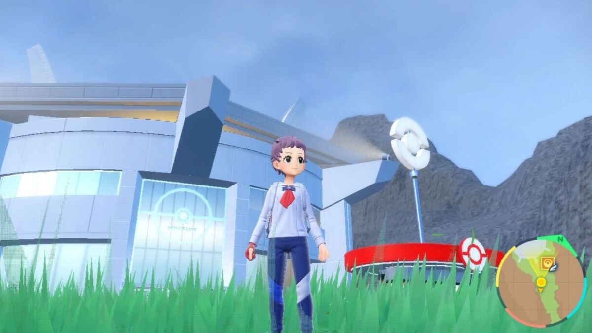 Pokemon Scarlet & Violet character standing outside the Pokémon League in the grass.