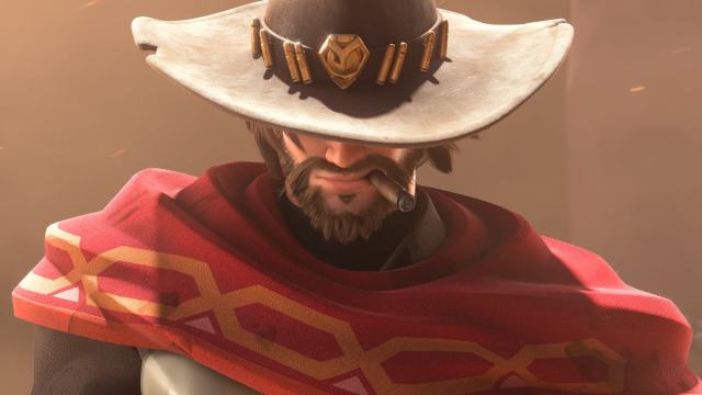 A close up shot of Cassidy with cigar in his mouth and cowboy hat covering half his face