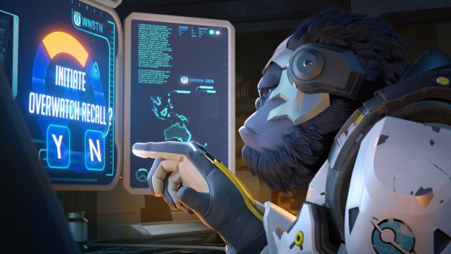 Side profile shot of Winston looking at and reading entries on a monitor with his finger pointed at the screen