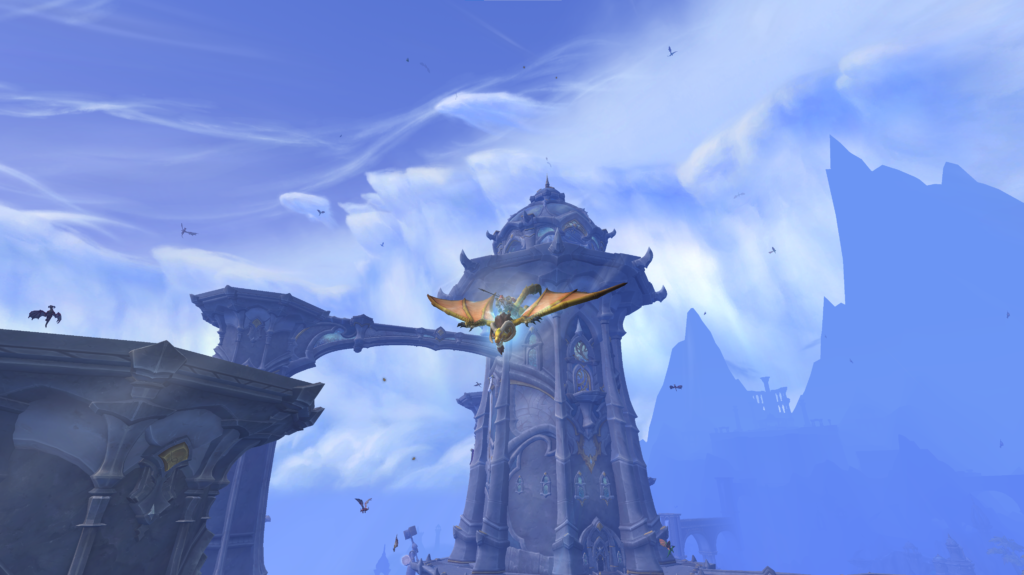 WoW player flying on a Dragonriding mount in Thaldraszus.