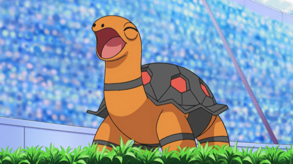Torkoal standing in a grassy stadium in the Pokémon anime.