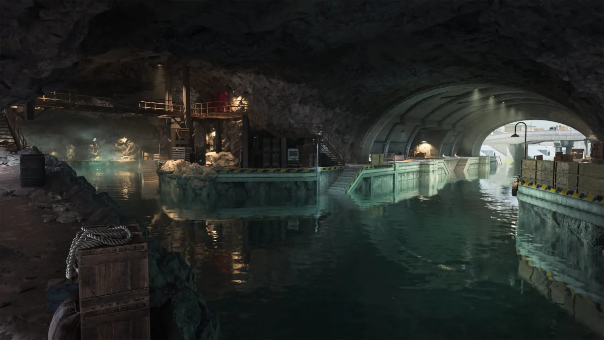 An underground cavern with aqua water, lit by electric lights on Ashika Island in DMZ.