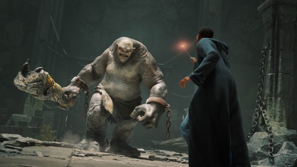 A wizard fighting a troll in the dungeon, a true rite of passage at Hogwarts.