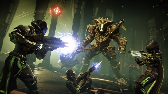 A Hive boss fighting a trio of Guardians in Destiny 2.