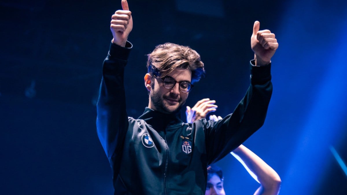 Ceb, a Dota 2 player, puts his thumbs up as he walks off stage at a Dota tournament.