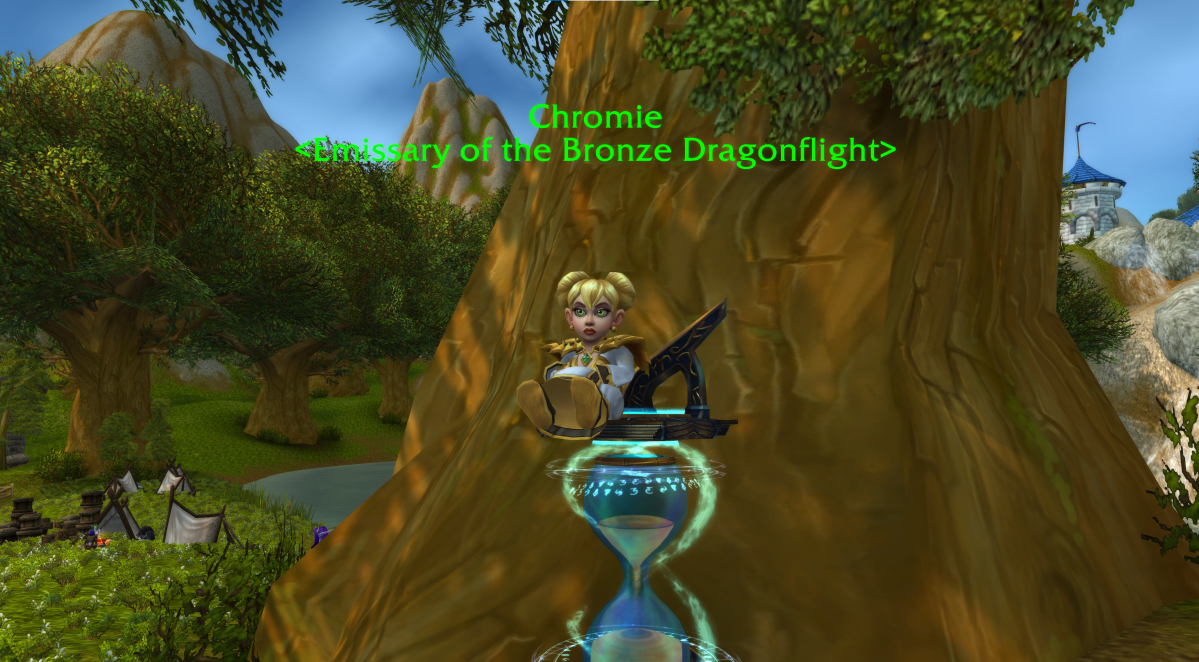 An in-game WoW screenshot of Chromie sitting on top of an hourglass in front of a tree in Stormwind City.