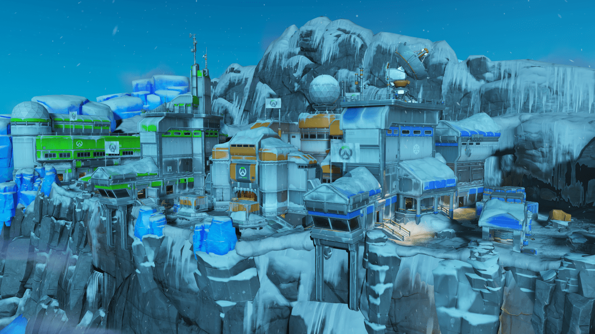 A screenshot of Antarctic Peninsula, in which a collection of buildings sit atop a snowy side of a cliff