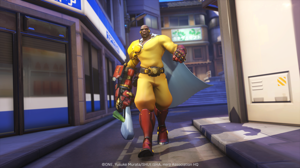 Doomfist's One Punch Man skin, in a mostly yellow outfit.