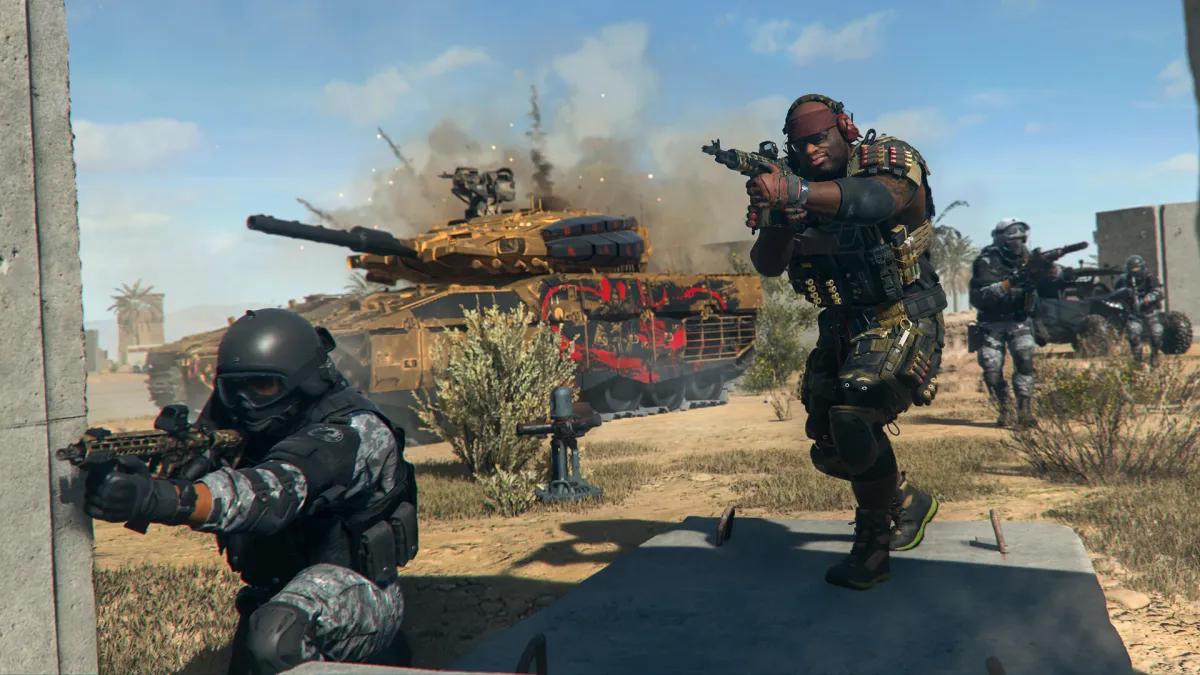 Operators covered by a tank move up in Call of Duty Modern Warfare 2.