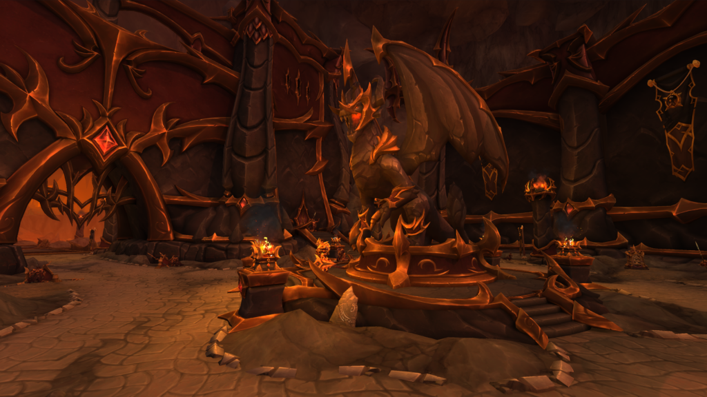 The exterior of Aberrus, featuring a statue of a member of the black dragonflight surrounded by orange flames and cragged rocks.