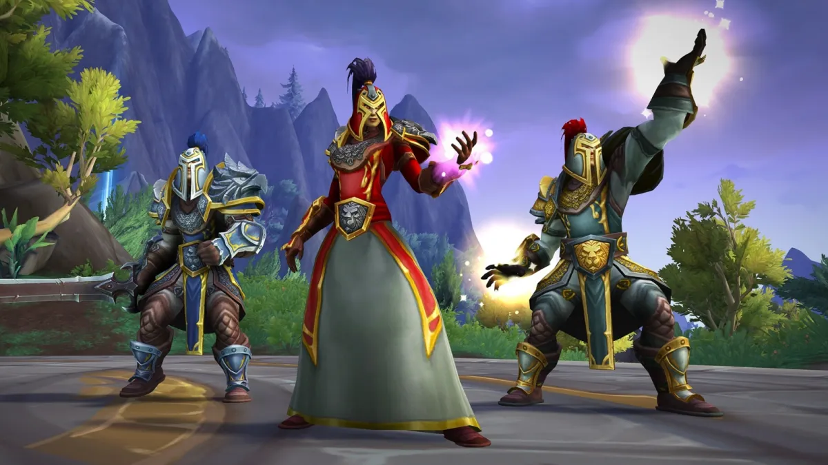 Three human WoW characters in different Heritage Armors