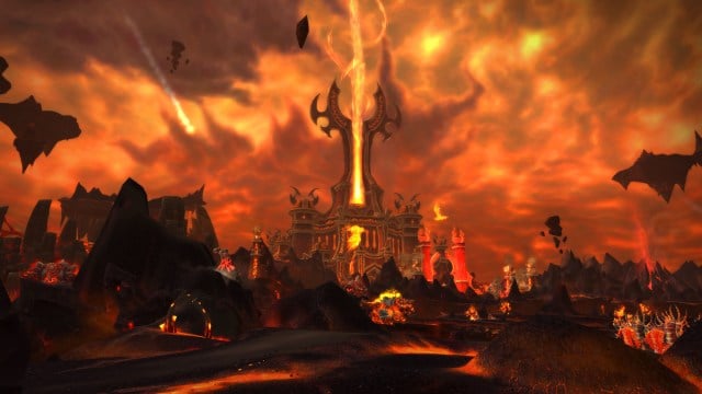 A hellscape of fire and rock with a tower firing a beam of red energy in the sky in  WoW: Cataclysm.