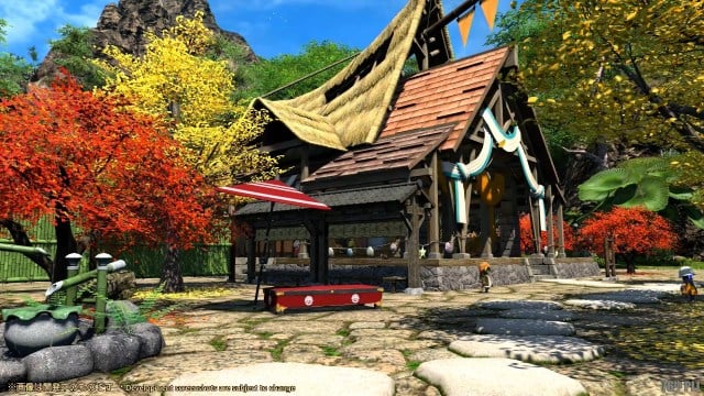 A players hideaway in Final Fantasy XIV, a wooden building with a thatched roof, with red and yellow trees beside it. 
